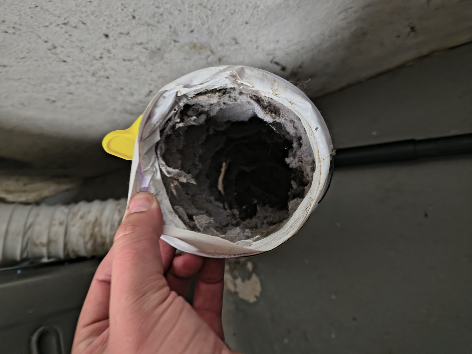 Clogged dryer transition hose before replacement