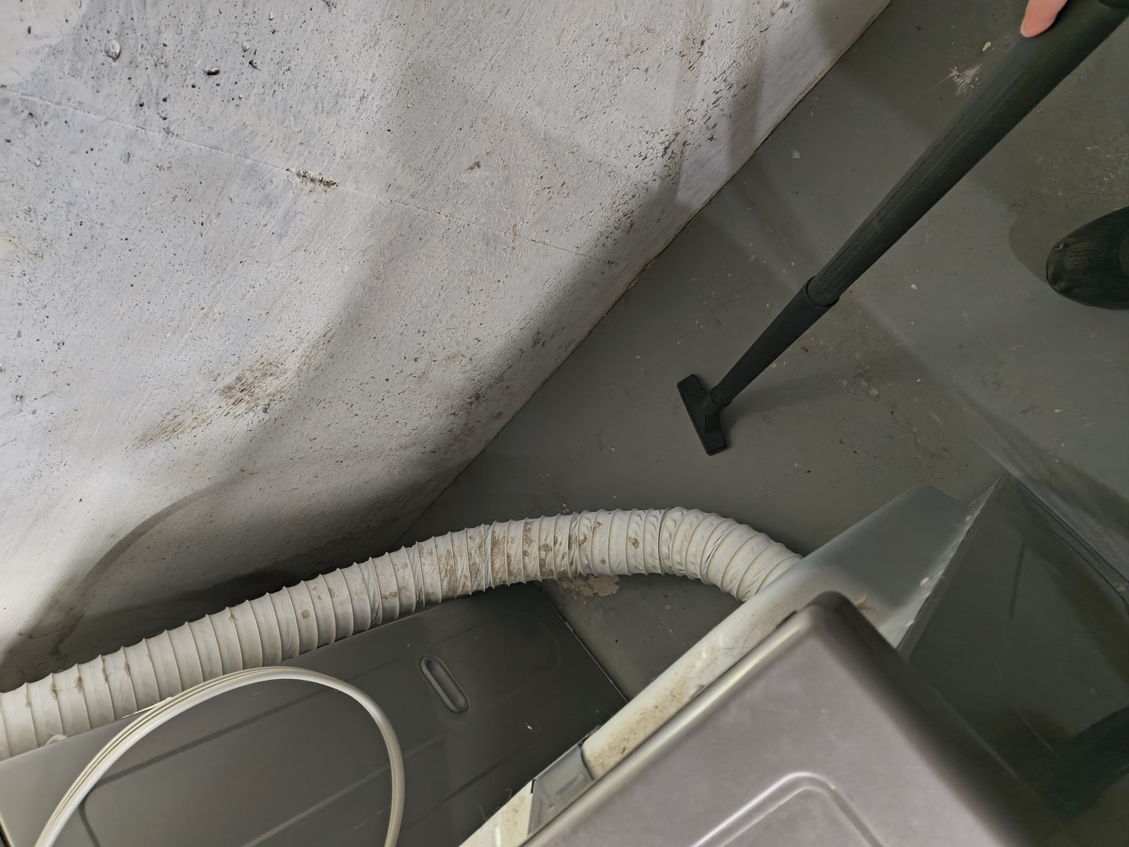 Dryer vent hose and surrounding area being cleaned