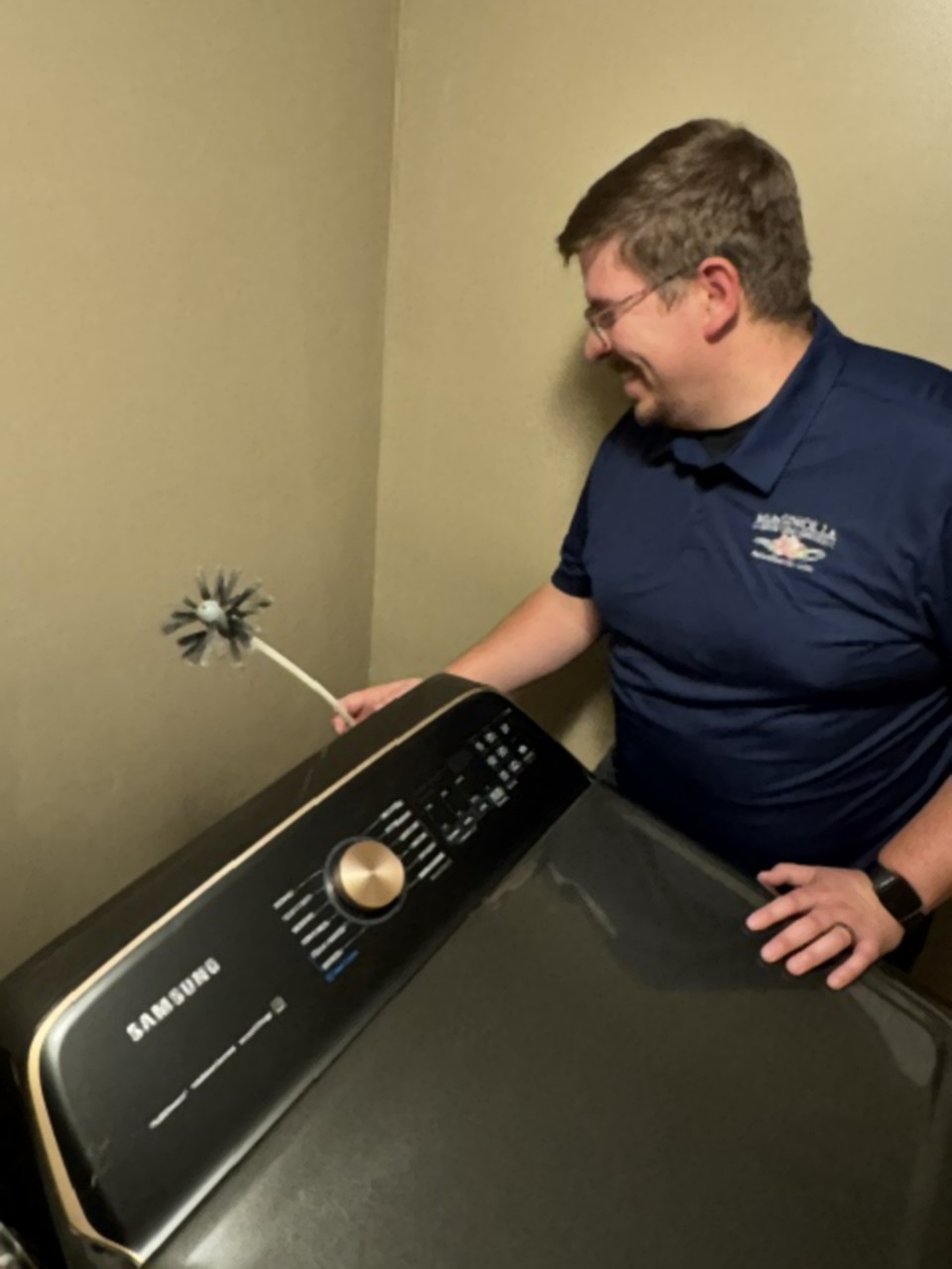 Magnolia Dryer Vent Services technician cleaning a dryer vent in Kansas City